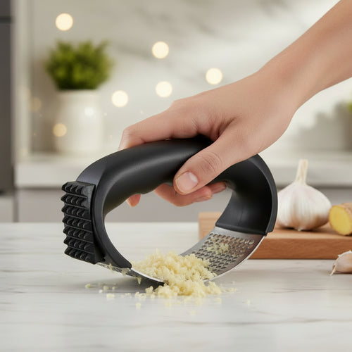 Black garlic press with metal surface